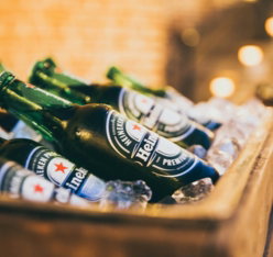 heineken-bottles-placed-on-brown-cooler-box.jpg Heineken bottles placed on brown cooler box